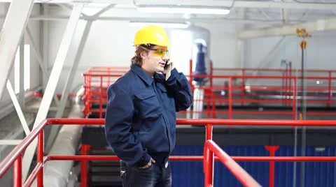 Worker talking on a mobile phone Stock Footage 8945561