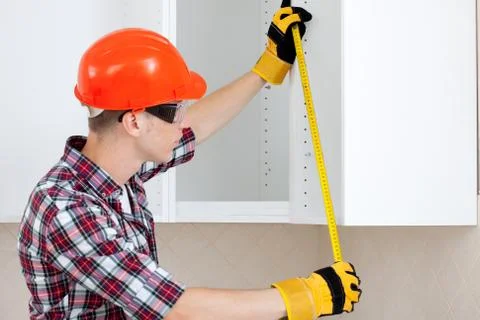 Worker with a tape measure Stock Photos