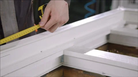 Worker with a tape measure - Plastic windows manufacture Stock Footage 40541388