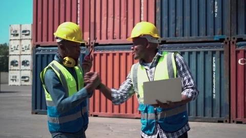 Worker team checking containers box, Dock workers in a shipyard Stock Footage 166879418