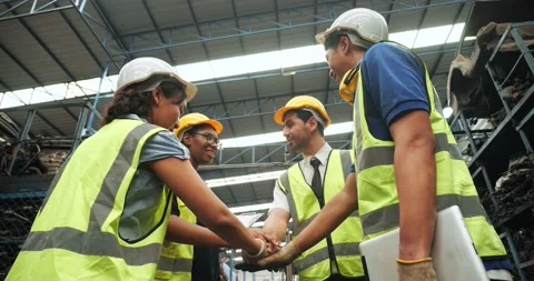 Worker team group putting hands together at warehouse factory Stock Footage 157625903
