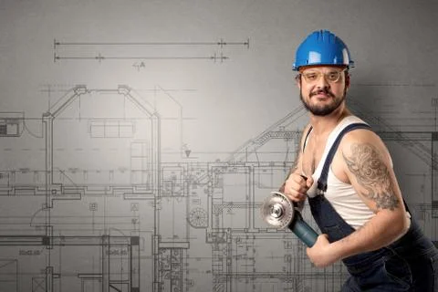 Worker with technical drawing. Stock Photos