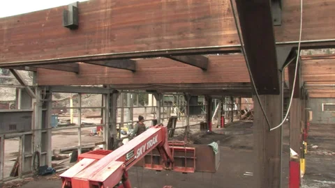 Worker on Telehandler Disassembling Wood Beams at Deconstruction Site in Bonner Stock Footage 134204597