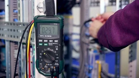 A worker test electrical equipment on a factory Stock-Footage 71572136