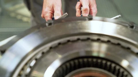 Worker testing gears with high pressure machine. Stock Footage 111718745