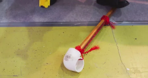 Worker testing plastic pipe resistance with hammer Stock Footage 302277943