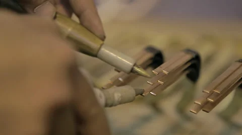 Worker tests electrical current in armature  Stock Footage 41669983