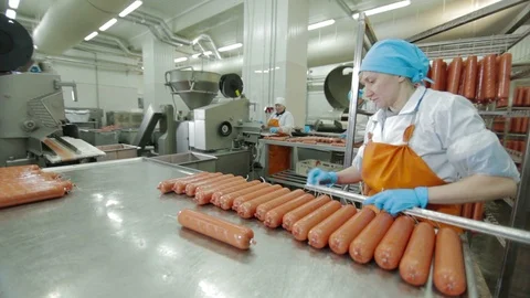 Worker Thread Sausages on the Metal Stick Stock Footage 94157822