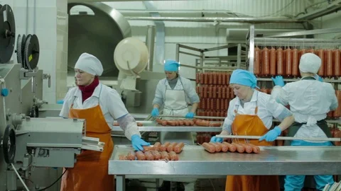 Worker Thread Sausages on the Metal Stick Stock Footage 94157983