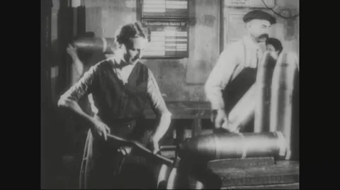 Worker tightening the metal casing of missile Stock Footage