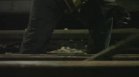 Worker tightening rails using wrench Stock Footage 44285918