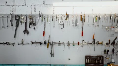 Worker tools and equipment on the wall of the garage, 4K. Set of hand tools Vidéo 136254025