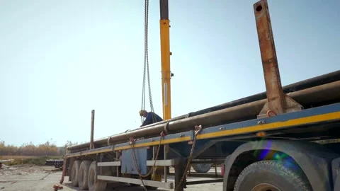 The worker touches the load, the worker prepares the load for unloading Stock Footage 142494844