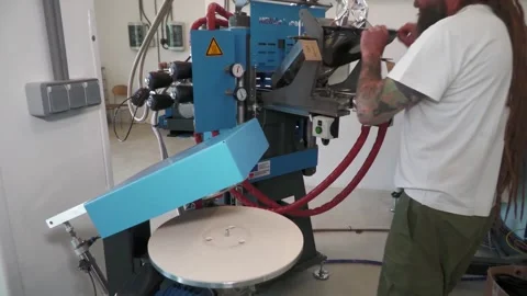 Worker Transferring Pressed Vinyl Record to Trimming Machine Stock Footage 342021439