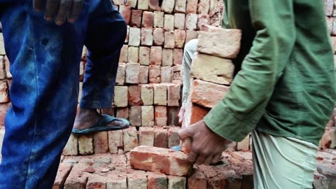 Worker Transporting Bricks By Hand Stock Footage 320958541
