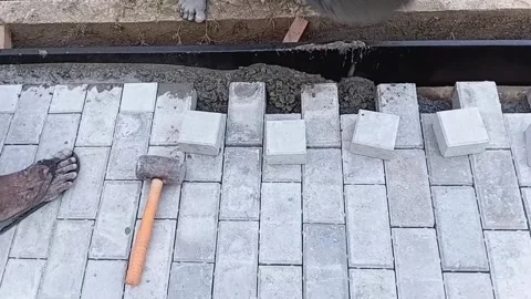 Worker Transporting Cement Buckets to Edge Paving Stock-Footage 339537188