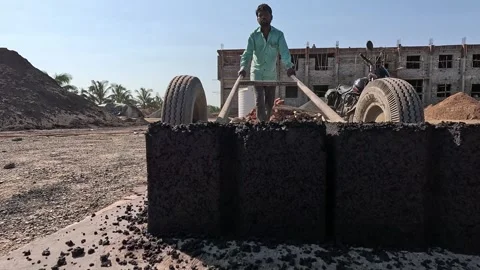Worker Transporting Concrete Blocks on Manual Hand Cart at Industrial Stock Footage 340564334