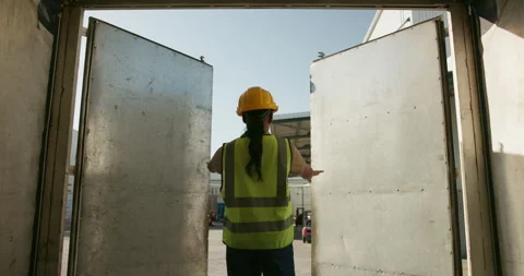 Worker, truck and door with open for delivery in logistics, supply chain and Stock Footage 270735588