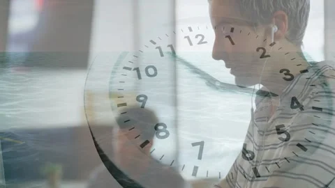 Worker turning head, typing on PC in tech, cam pulling back, clock overlay, Stock Footage 328329568
