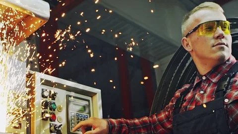 Worker turning machine on Stock Footage 82647333