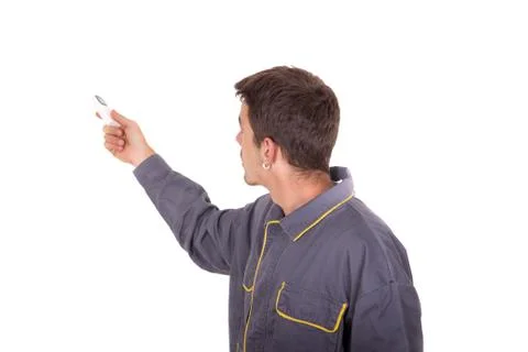 Worker turns on an electronic unit Stock Photos