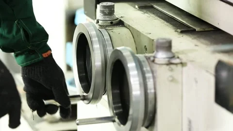 Worker turns the handle of a milling machine Stock Footage 162913540