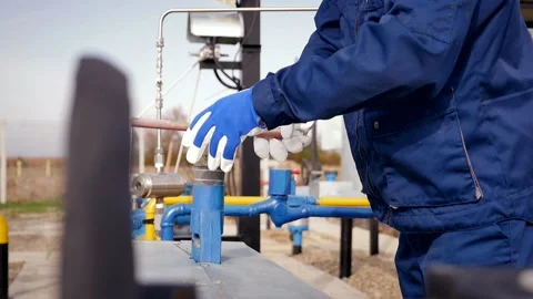 The worker turns the valve, slow motion 스톡 동영상 142496046