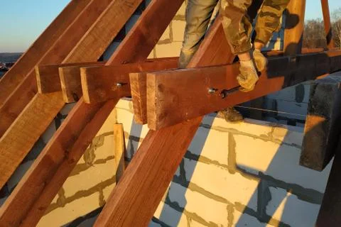 The worker twists the bar of the rack using a wrench Stock Photos