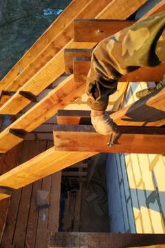 The worker twists the bar of the rack using a wrench Stock Photos