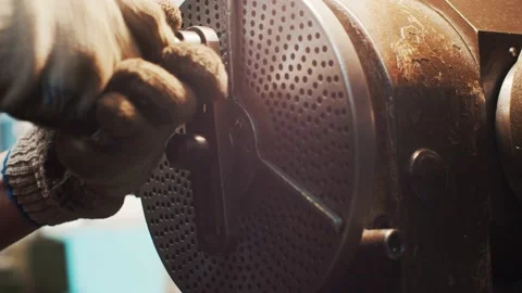 The worker twists the handle of the machine Vídeo Stock 163290865