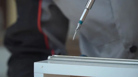 Worker twists the screw with a drill Stock Footage 89546479