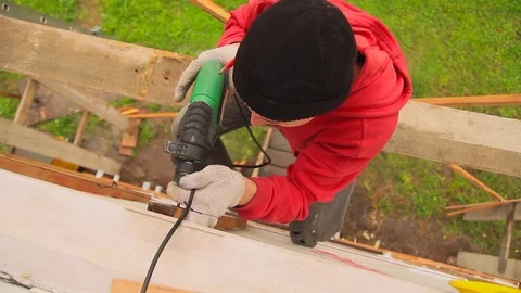 Worker twists screws Stock Footage 79912447