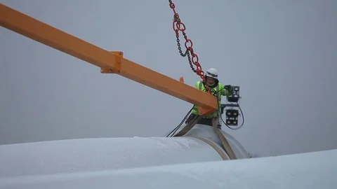 Worker Tying Rotor Blade With a Rope Stock Footage 72189133