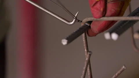 Worker tying steel reinforcement bars with binding wire close up Vídeo Stock 341986594