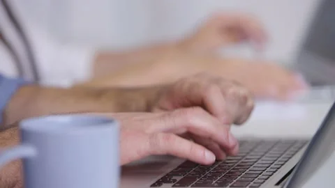 Worker typing working on modern laptop doing research in office Stock Footage 236588692