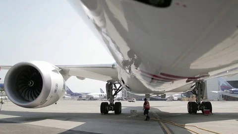 Worker under airplane Stock Footage 77129425