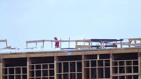 Worker on unfinished building Stock Footage 77099722