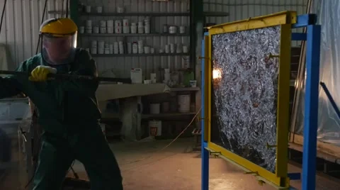 Worker In Uniform And Protective Screen, Yellow Gloves, is Beating the Glass Stock Footage 53012740