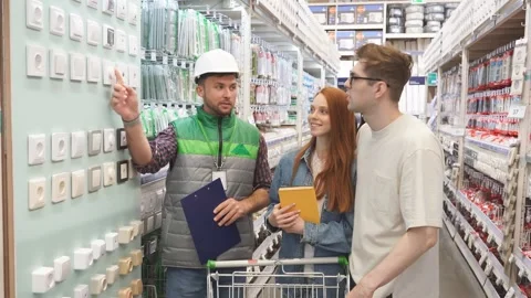 Worker in uniform consult customers, give necessary information. Stock Footage 140225975