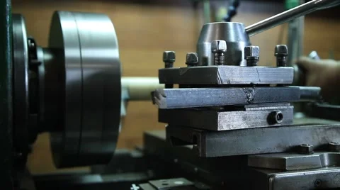 Worker in uniform operating manual lathe Stock Footage 68420250