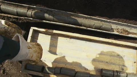 Worker in Uniform Puts down Ground Sample into Box Stock Footage 89028528