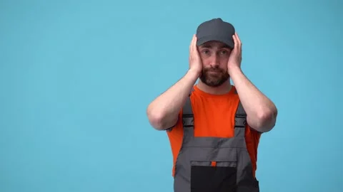 The worker in uniform is shocked by the problems and does not know how to solve Video stock 188096643
