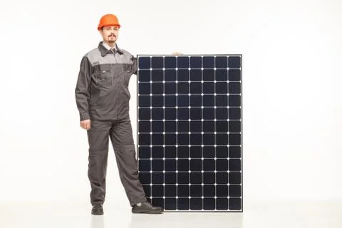 Worker in uniform with solar panels Stock Photos