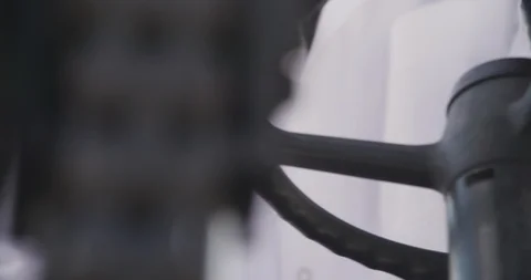 Worker in uniform turns steering wheel in forklift loader cabin. Stock Footage 117293746