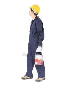 Worker in uniform using paint roller is painting invisible wall Stock Photos