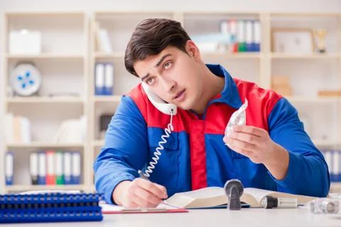 Worker in uniform working on project Stock-Fotos