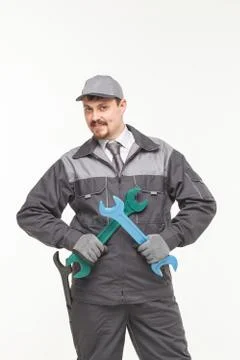 Worker in uniform with wrench Stock Photos