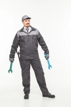 Worker in uniform with wrench Stock Photos