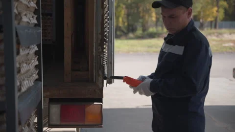 Worker unloading the truck delivering the poultry industry eggs products Stock Footage 277295173
