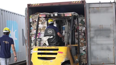 Worker unloading waste paper block by fo... | Stock Video | Pond5